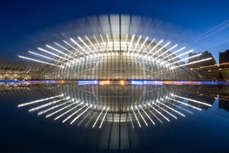 Photo for Panoramic night view with refelection and long exposure blurred zoom effect in water from Hemisferic de les Arts in Valencia, Spain - Royalty Free Image