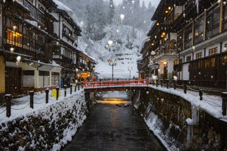 Photo for Japan - January 30, 2019 : Scenic view of Old Hot Spiring Accomodation in Winter with Illumination in the evening, Ginzan Onsen is most famous Hot Spring in Yamagata, Japan - Royalty Free Image