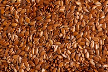 Foto de Fondo o textura de las semillas de lino. linaza o linaza. Cereales. Comida saludable. Vista superior. Foto de alta calidad - Imagen libre de derechos