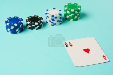 Photo for Poker chips and playing cards on colorful background. - Royalty Free Image