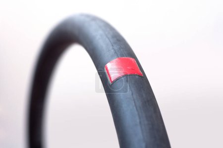 Photo for Bicycle inner tube and repair patch. Bicycle maintenance - Royalty Free Image