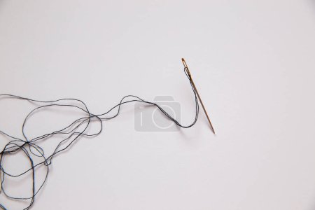 Photo for Needle with thread on a white background - Royalty Free Image