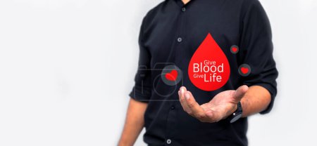 Join the global campaign for World Blood Donor Day. Capture the essence of humanity and lifesaving altruism with striking images of a man holding red paper, symbolizing the vital act of blood donation. Give back, save lives, and spread awareness