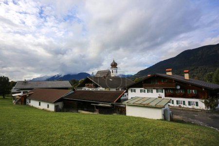 Photo for The picturesque church village Wamberg on impressive mountain landscape, near Garmisch Partenkirchen, Germany - Royalty Free Image