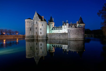 Sully Sur Loire, France - April 13, 2019: Famous medieval castle Sully sur Loire at sunset, Loire valley, France. The chateau of Sully sur Loire dates from the end of the 14th century.