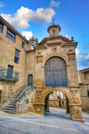 Photo for Portal de Orta and Chapel of San Antonio in the town of Calaceite, Teruel. Spain. The Orta portal is one of the two portals of the old wall that are still preserved from the four that closed the walled town. - Royalty Free Image