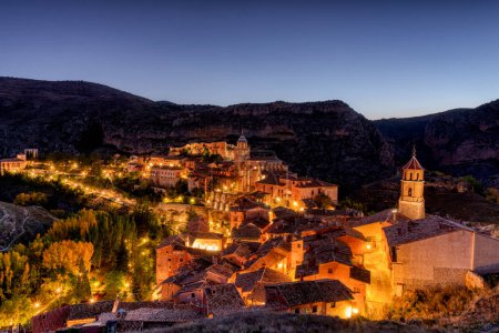 Views of Albarracin at sunrise with the church of Santa Maria y Santiago in the foreground. Teruel, Spain.