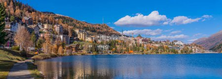 Panorama view over the St. Moritz lake in St. Moritz in autumn colours in Engadine, background the mountains