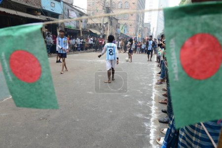 Photo for Children wearing jersey Argentina and France play football on the street during the FIFA World Cup tournament in Qatar, in Dhaka, Bangladesh, on December 16, 2022 - Royalty Free Image