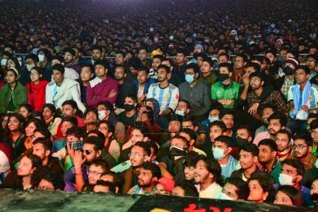 Photo for Bangladeshi soccer fans watch on a big screen a public broadcast of the FIFA World Cup Qatar 2022 match between Argentina and France final Match at the Dhaka University Campus, in Dhaka, Bangladesh, on December18, 2022. - Royalty Free Image