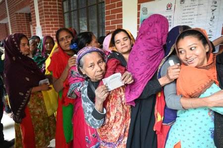 Photo for Women voters are waiting for casts their vote in a queue in a polling station during the 12th general election day in Dhaka, Bangladesh, on January 7, 2024. - Royalty Free Image