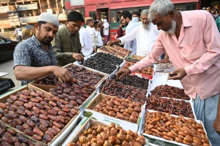 Photo for Bangladeshi Muslims people buy dates ahead of the holy month of Ramadan in Dhaka, Bangladesh, on March 10, 2024. - Royalty Free Image