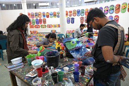 Photo for Student of Faculty of Fine arts of Dhaka University painting masks for colorful preparation to celebrate upcoming Bengali New Year 1431 in Dhaka, Bangladesh, on March 30, 2024. Pahela Baishakh (the first day of the Bangla month) can be followed back - Royalty Free Image