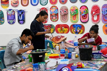 Photo for Student of Faculty of Fine arts of Dhaka University painting masks for colorful preparation to celebrate upcoming Bengali New Year 1431 in Dhaka, Bangladesh, on March 30, 2024. Pahela Baishakh (the first day of the Bangla month) can be followed back - Royalty Free Image