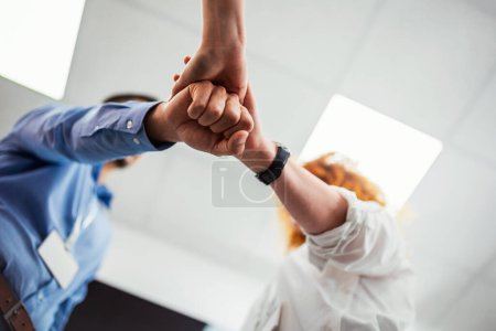 Photo for Close up of hands of young people friends holding together, unity teamwork support concept - Royalty Free Image