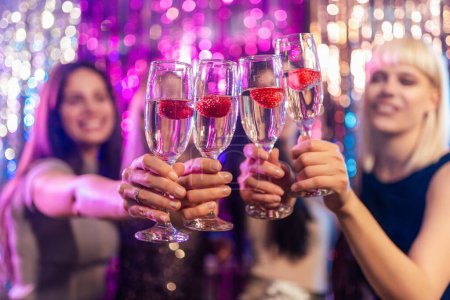 Photo for Portrait of girls's drinks at the club. Drinking alcohol - Royalty Free Image