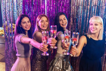 Photo for Beutiful young girls clubbing, drinking alcohol and having fun. - Royalty Free Image