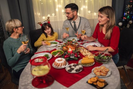 Photo for Happy multi-generation family enjoying in a lunch together at home. Family on Christmas dinner at home - Royalty Free Image