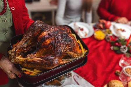 Photo for Tasty turkey on the dining table. Family Christmas dinner. - Royalty Free Image