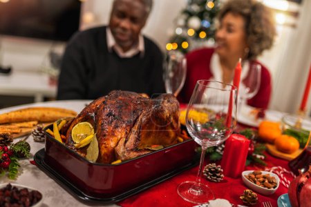 Photo for Roasted turkey served on the dining table for family Christmas dinner. - Royalty Free Image