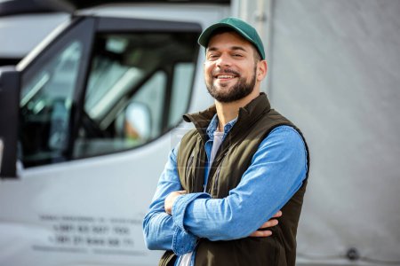 Photo for Happy confident male driver standing in front on his truck - Royalty Free Image