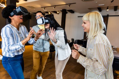 Photo for Business people making team training exercise during team building seminar using VR glasses - Royalty Free Image