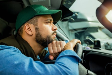 Photo for Truck driver feeling tired during the ride. - Royalty Free Image