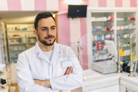 Photo for Portrait of male pharmacist at the modern pharmacy, drugstore. - Royalty Free Image