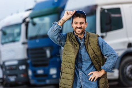 Photo for Happy confident male driver standing in front of his truck. - Royalty Free Image