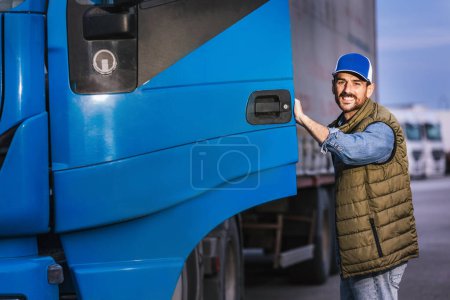 Photo for Happy confident male driver entering his long vehicle. - Royalty Free Image
