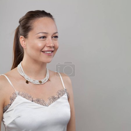 Photo for Pearl necklace on neck of beautiful woman - Royalty Free Image