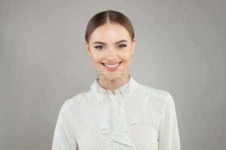 Happy smiling woman looking at camera on white background