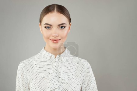 Portrait of Charming woman looking at camera on white background
