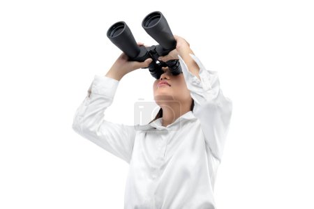 Photo for Asian businesswoman looking through binoculars isolated over white background - Royalty Free Image