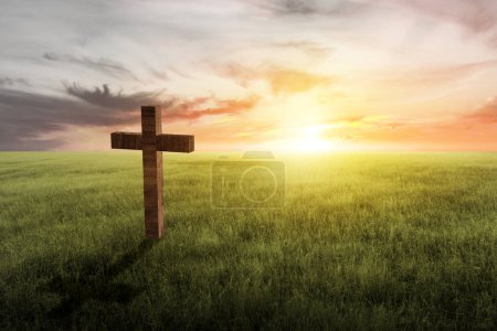 Téléchargez les photos : Christian Cross on the field with sunset sky background - en image libre de droit