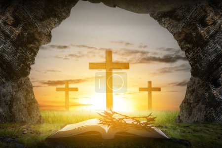 Christian Cross and open book with a crown of thorns with a sunset scene background. Palm Sunday Concept