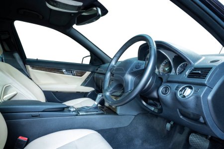 Steering wheel, shift lever, dashboard, speedometer display. Modern car interior