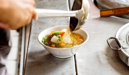 Photo for Chicken soup (Soto Ayam) is street food on Suryakencana Street. Traditional Indonesia food - Royalty Free Image