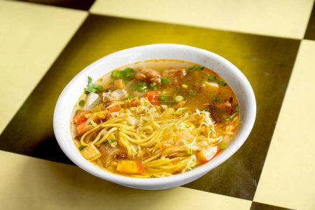 Photo for Chicken soup (Soto Ayam) is street food on Suryakencana Street. Traditional Indonesia food - Royalty Free Image