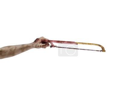 Photo for The hand of a scary zombie with blood and wounds carrying a saw is isolated over a white background - Royalty Free Image