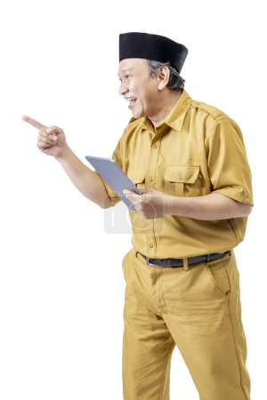 Photo for A civil servant man using a tablet isolated over a white background. Pegawai Negeri Sipil (PNS) - Royalty Free Image
