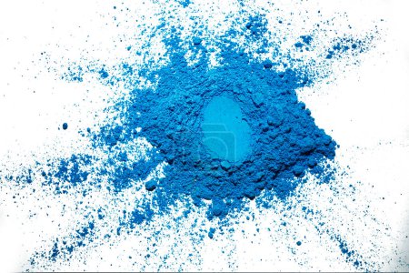 Photo for Closeup view of blue Holi powder isolated over a white background. Holi festival concept - Royalty Free Image
