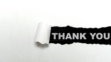 Photo for Ripped paper with Thank You text on a black background. Thank you concept - Royalty Free Image