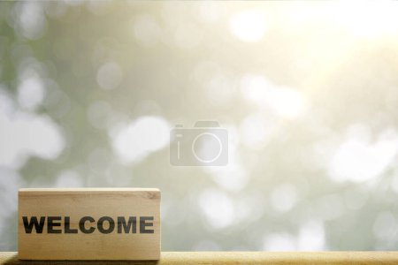 Photo for Wooden block with welcome text with blurred background. Introduction concept - Royalty Free Image