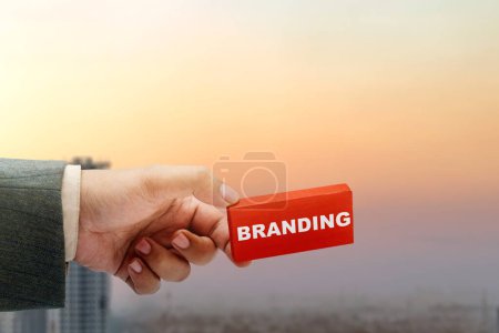 Foto de Business hand showing wooden block with branding text. Build brand concept - Imagen libre de derechos