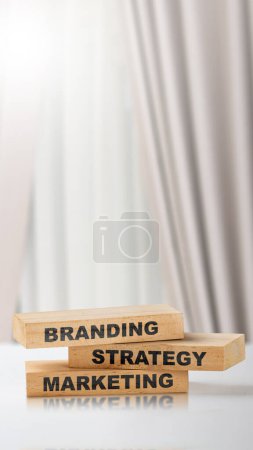 Foto de Stack of small wooden blocks with branding strategy marketing text on the table. Build brand concept - Imagen libre de derechos