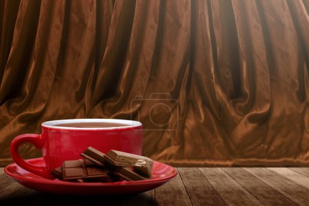 Foto de Chocolate pieces on chocolate drink in the cup on the table. World Chocolate Day concept - Imagen libre de derechos