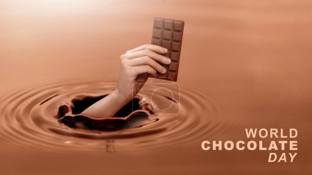 Foto de Close up human hand holding a chocolate bar that appears on the surface of a chocolate liquid, concept of giving on world chocolate day. Sweet and energy snack. Mock up deisign. - Imagen libre de derechos