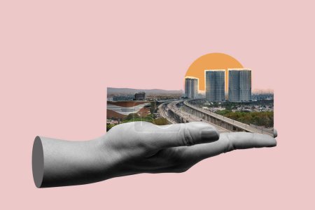 Conceptual composite image depicting a miniature city and highway balance on the palm of a hand against a sunset background, illustrating city planning and urban growth
