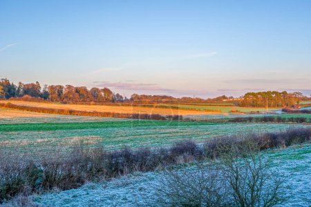 Photo for Beautiful Scottish Farmlands in heavy frost with farming fields at the heart of Burns country at Perceton Mains between Stewarton and Irvine in Scotland. - Royalty Free Image